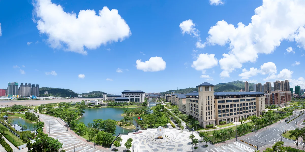 University of Macau lake and surrounding academic buildings in daylight